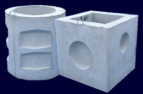 Concrete manhole sections on dark background